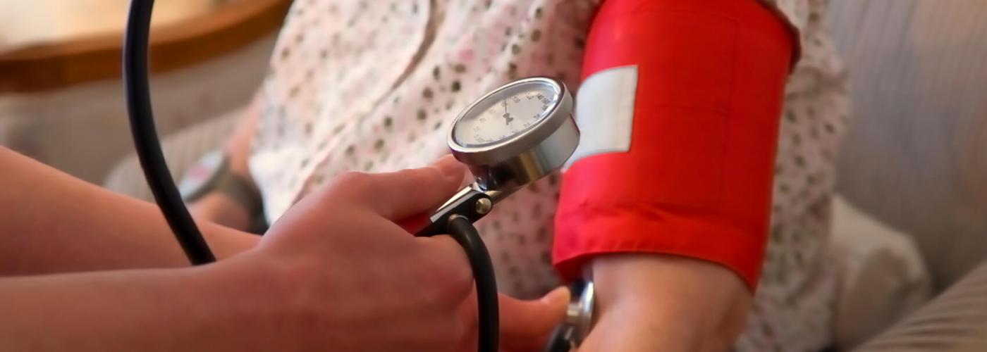 Patient getting her blood pressure checked.